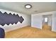 Bonus room with neutral carpet, white walls, acoustic dampening, and convenient access to other areas at 1510 Shorewood Dr, Auburndale, FL 33823