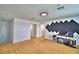 Spacious bonus room featuring neutral carpet, white walls, acoustic dampening, and ample natural light at 1510 Shorewood Dr, Auburndale, FL 33823