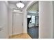 Light and bright entryway with tile floors, neutral walls, and an arched entryway to the home gym at 1510 Shorewood Dr, Auburndale, FL 33823