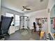 A dedicated home gym, including free weights, a weight machine, a treadmill, and rubber flooring at 1510 Shorewood Dr, Auburndale, FL 33823