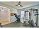 A dedicated home gym, including free weights, a weight machine, a treadmill, and rubber flooring at 1510 Shorewood Dr, Auburndale, FL 33823