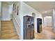Hallway with stairwell and black display cabinets at 1510 Shorewood Dr, Auburndale, FL 33823