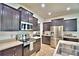 Well-equipped kitchen features stainless steel appliances and ample dark wood cabinetry at 1510 Shorewood Dr, Auburndale, FL 33823