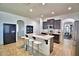 Spacious kitchen with island featuring breakfast bar seating and modern fixtures at 1510 Shorewood Dr, Auburndale, FL 33823