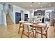 Open-concept kitchen and dining area with modern furniture and bright lighting at 1510 Shorewood Dr, Auburndale, FL 33823