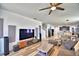 Spacious living room featuring wood floors, a modern media center, and recessed lighting at 1510 Shorewood Dr, Auburndale, FL 33823