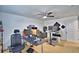 Large office with ceiling fan, multiple computers and a comfortable chair at 1510 Shorewood Dr, Auburndale, FL 33823