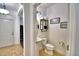 Powder room with a pedestal sink, a modern black light fixture, and decor at 1510 Shorewood Dr, Auburndale, FL 33823