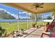 Relaxing screened porch with fan overlooking the spacious, green backyard at 1510 Shorewood Dr, Auburndale, FL 33823
