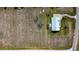 Expansive lot featuring a single-story home and large vacant field, perfect for development or farming opportunities at 1815 Adams Barn Rd, Lake Alfred, FL 33850