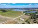 Scenic aerial view featuring a large tract of land ideal for farming or development with lake views at 1815 Adams Barn Rd, Lake Alfred, FL 33850