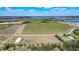 Aerial view showing a large tract of land ideal for farming or development with lake views at 1815 Adams Barn Rd, Lake Alfred, FL 33850
