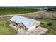 Aerial view of brick home showing the new roof and an attached two car garage at 1815 Adams Barn Rd, Lake Alfred, FL 33850