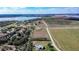 Scenic aerial view of a property surrounded by fields, lakes and other houses, showcasing its peaceful location at 1815 Adams Barn Rd, Lake Alfred, FL 33850