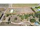 Expansive property featuring a home, adjacent to a citrus grove, offering ample space for various uses at 1815 Adams Barn Rd, Lake Alfred, FL 33850