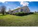 Brick house exterior with screened in back porch and lots of natural light streaming through the many windows at 1815 Adams Barn Rd, Lake Alfred, FL 33850