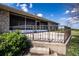 Backyard with a paved patio, metal fence, and green bushes along the side of the property at 1815 Adams Barn Rd, Lake Alfred, FL 33850