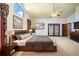 Large bedroom with a high ceiling, a television, and an adjoining set of french doors at 1815 Adams Barn Rd, Lake Alfred, FL 33850