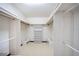 Spacious walk-in closet featuring plenty of storage space for clothes, shoes, and accessories at 1815 Adams Barn Rd, Lake Alfred, FL 33850