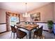 Traditional dining room with chandelier and seating for six at 1815 Adams Barn Rd, Lake Alfred, FL 33850