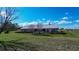 Charming single-story home with lush green lawn and mature trees, offering serene outdoor living at 1815 Adams Barn Rd, Lake Alfred, FL 33850