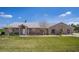 Sprawling brick ranch-style home with mature landscaping and well manicured lawn at 1815 Adams Barn Rd, Lake Alfred, FL 33850