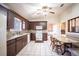 Open-concept kitchen with stainless steel appliances and dining area at 1815 Adams Barn Rd, Lake Alfred, FL 33850