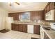 Cozy kitchen with stainless steel appliances and ample cabinet space at 1815 Adams Barn Rd, Lake Alfred, FL 33850