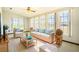 Bright sunroom with wicker furniture and large windows at 1815 Adams Barn Rd, Lake Alfred, FL 33850
