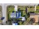 A bird's eye view of the residence displaying the pool, fenced yard, and the home's layout on the lot at 1817 Mckeown Ave, Haines City, FL 33844