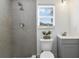 Modern bathroom with gray tile shower, contemporary vanity, and a bright window at 1817 Mckeown Ave, Haines City, FL 33844