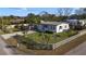 Charming single-story home with a metal roof, a fenced yard, and well-maintained landscaping at 1817 Mckeown Ave, Haines City, FL 33844
