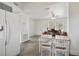 Bright living room and eat in kitchen featuring a dining table, and lots of natural light at 1817 Mckeown Ave, Haines City, FL 33844