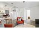 Inviting open living room with modern decor, eat-in kitchen, gray tile flooring, and lots of natural light at 1817 Mckeown Ave, Haines City, FL 33844