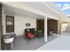 Inviting covered patio featuring modern furniture, accent lighting, and a stylish design for outdoor relaxation at 1817 Mckeown Ave, Haines City, FL 33844