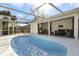 Sparkling in-ground pool with a screened lanai and a spacious outdoor living area at 1817 Mckeown Ave, Haines City, FL 33844