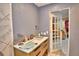 View of bathroom featuring modern vanity with sink and decorative tiled wall at 20 24Th Sw St, Winter Haven, FL 33880