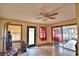 Bonus room with tile flooring, a ceiling fan, and natural light from the windows and sliding doors at 20 24Th Sw St, Winter Haven, FL 33880