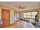 Bonus room with tile flooring, a ceiling fan, and natural light from the windows and sliding doors at 20 24Th Sw St, Winter Haven, FL 33880