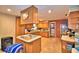 Well-lit kitchen with wooden cabinetry, tile floors, and an island at 20 24Th Sw St, Winter Haven, FL 33880