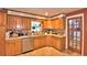 Efficient kitchen with stainless appliances, generous countertops, and natural wood cabinets at 20 24Th Sw St, Winter Haven, FL 33880