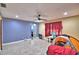 View of living room featuring tile floors, access to another room and bright light from windows at 20 24Th Sw St, Winter Haven, FL 33880