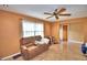 Relaxing living room featuring a cozy sofa and tile flooring at 20 24Th Sw St, Winter Haven, FL 33880