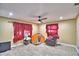 View of living room featuring tile floors, modern ceiling fan and bright light from windows at 20 24Th Sw St, Winter Haven, FL 33880