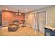 Open-concept living area with tile flooring and a view to the kitchen at 20 24Th Sw St, Winter Haven, FL 33880