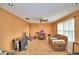 Open living room with tile flooring, ceiling fan, and abundant natural light at 20 24Th Sw St, Winter Haven, FL 33880