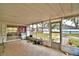Enclosed patio with screened windows offering a view of the backyard at 20 24Th Sw St, Winter Haven, FL 33880