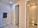 This bathroom features neutral tile flooring and separate toilet and closet areas at 200 Summershore Dr, Auburndale, FL 33823