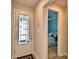 Bright foyer showcasing a glass-paneled front door with an adjacent bedroom view at 200 Summershore Dr, Auburndale, FL 33823