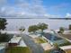 Waterfront home featuring solar panels, sandy beach area, boat dock and lakeside views at 253 Blackwell Villa Cv, Babson Park, FL 33827